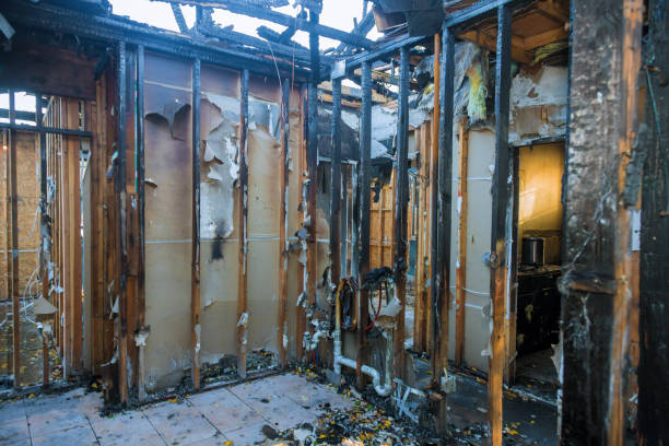 Professional Fire Damage Restoration technician working in Watertown, NY